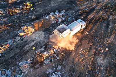 Landfill waste disposal. garbage dump with waste plastic. garbage truck unload rubbish in landfill. 