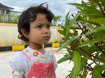 Portrait of cute girl looking away