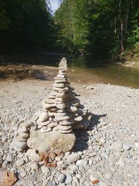 Stone stack on rock in forest