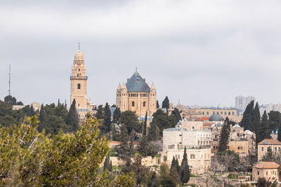 Buildings in city against sky