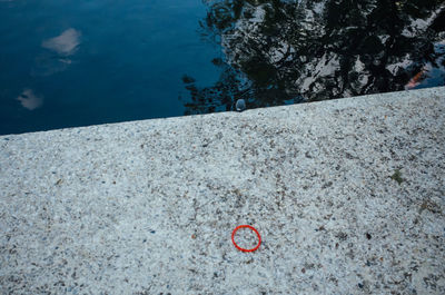 High angle view of heart shape on rock