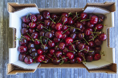 High angle view of cherries in box on table