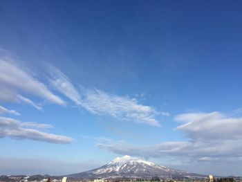 Scenic view of mountains against cloudy sky