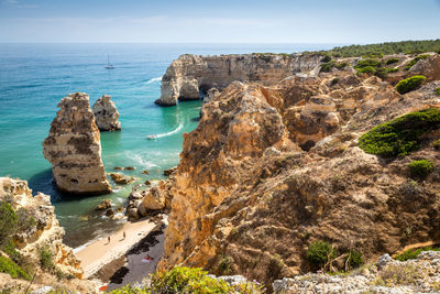 Panoramic view of sea and rock formation against sky