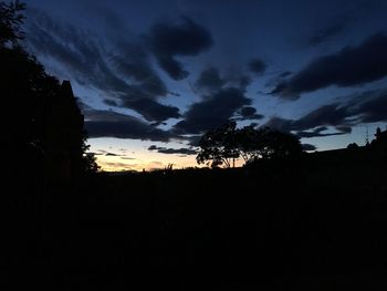 Silhouette landscape against sky during sunset