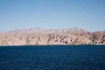 Scenic view of mountain against clear blue sky