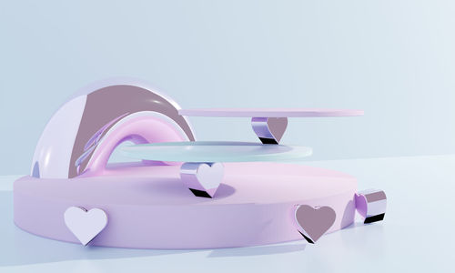 Close-up of pink balloons against white background