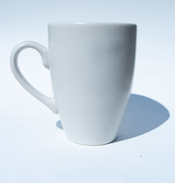 Close-up of coffee cup on white background