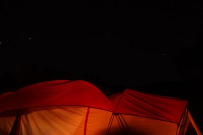 Low angle view of tent against sky at night