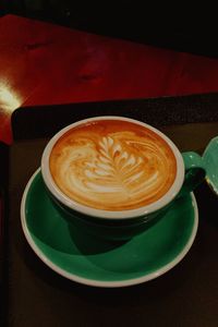 Close-up of cappuccino on table