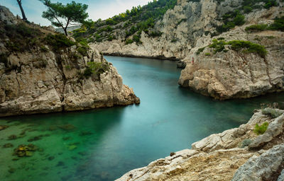 Scenic view of river by rock formation