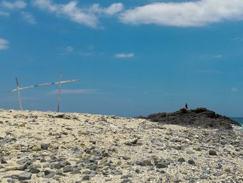 Low angle view of rocks on land against sky