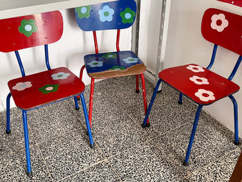 High angle view of empty chairs and table at playground