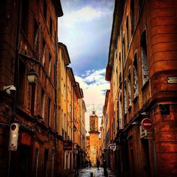 Narrow alley amidst buildings