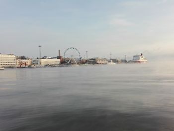 View of ferris wheel in sea