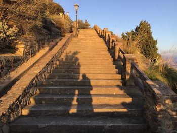 Shadow of staircase on footpath