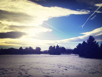 Scenic view of landscape against cloudy sky