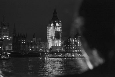 Illuminated elizabeth tower against sky in city at night