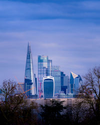 Modern buildings against sky in city