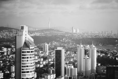 High angle view of buildings in city against sky