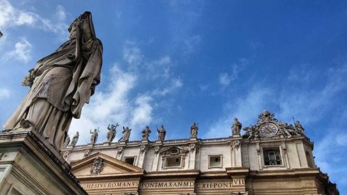 Low angle view of historical building against cloudy sky