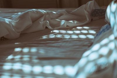 Close-up of woman lying on bed