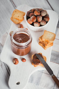 Little toasts with sweet chocolate spread for breakfast.