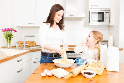 Happy mother with daughter at home