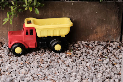 High angle view of toy car on stones