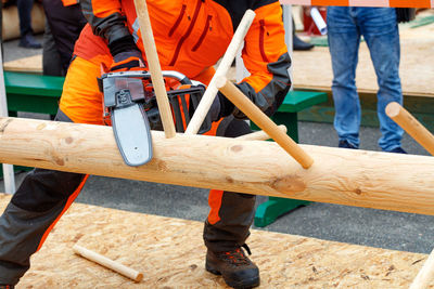 Low section of man working at workshop