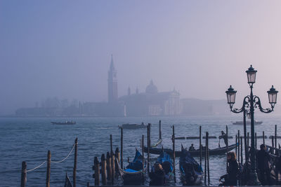 Panoramic view of sea and buildings against sky