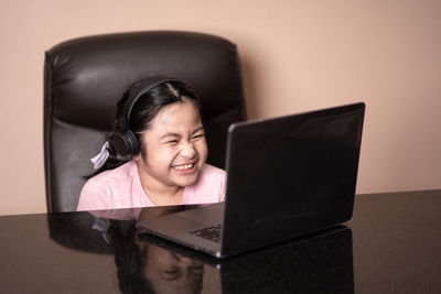 Portrait of smiling woman using mobile phone