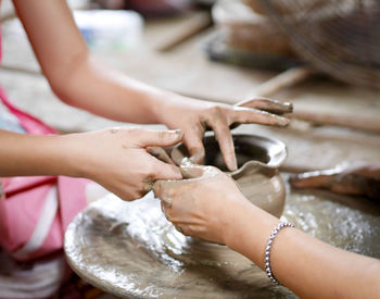 Low section of man washing hands