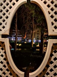 Reflection of illuminated building in city at night