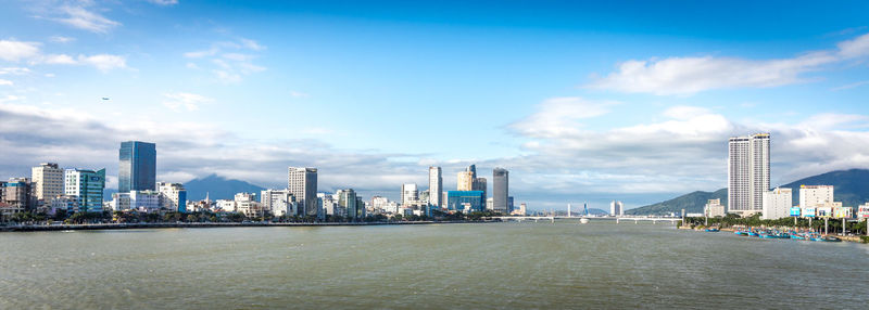 Modern buildings in city against sky