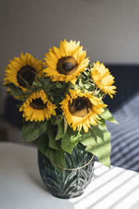 Close-up of sunflowers in vase on table