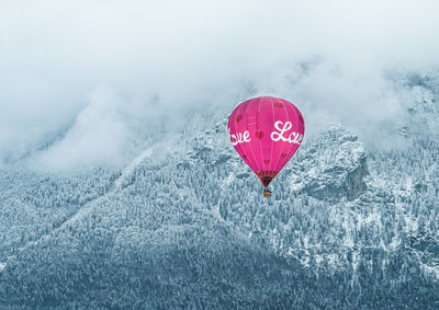 Hot air balloon with the word love in a winter environment