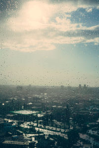 Full frame shot of wet window in city