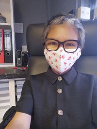 Close-up portrait of a cute girl standing outdoors