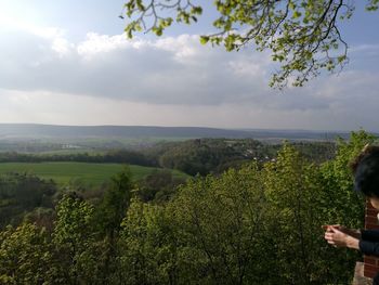 Scenic view of green landscape against sky