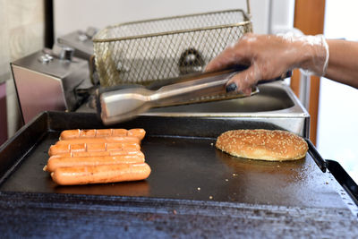 Cropped hand preparing food