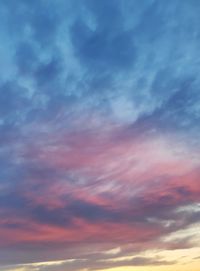 Low angle view of dramatic sky during sunset