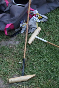 Low section of person sitting on field