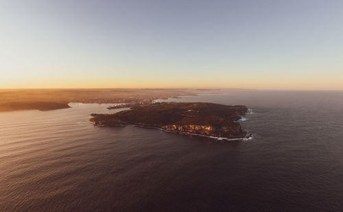 High angle view of sea against sky during sunset