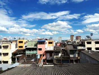 Residential buildings against blue sky