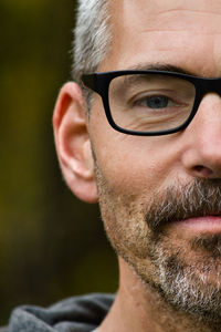 Close-up of man wearing eyeglasses