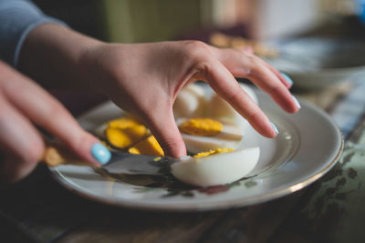 Close-up of hand holding ice cream