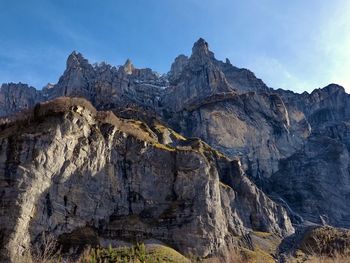 Panoramic view of rocky mountains against sky