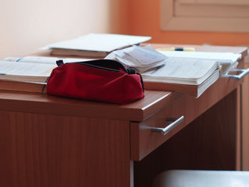 Close-up of red book on table