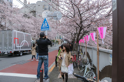 People walking on road in city